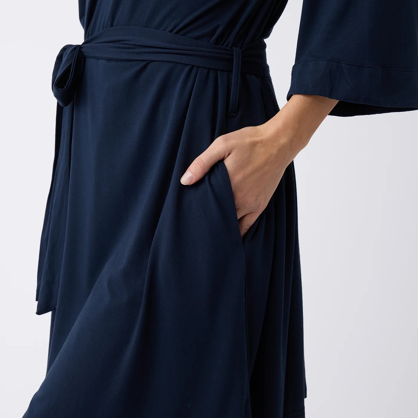 Navy@woman wearing a navy cozy earth robe
