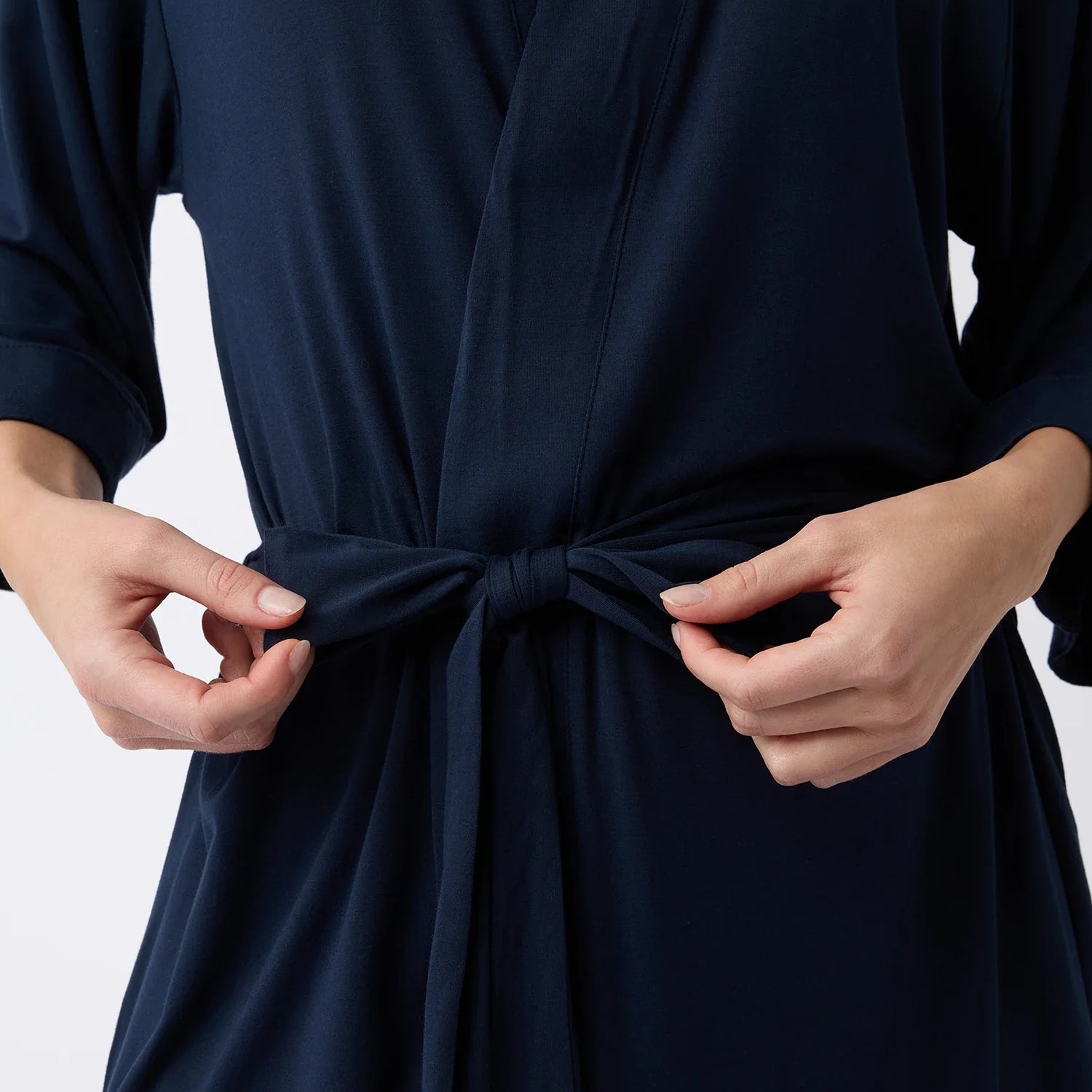 Navy@woman wearing a navy cozy earth robe