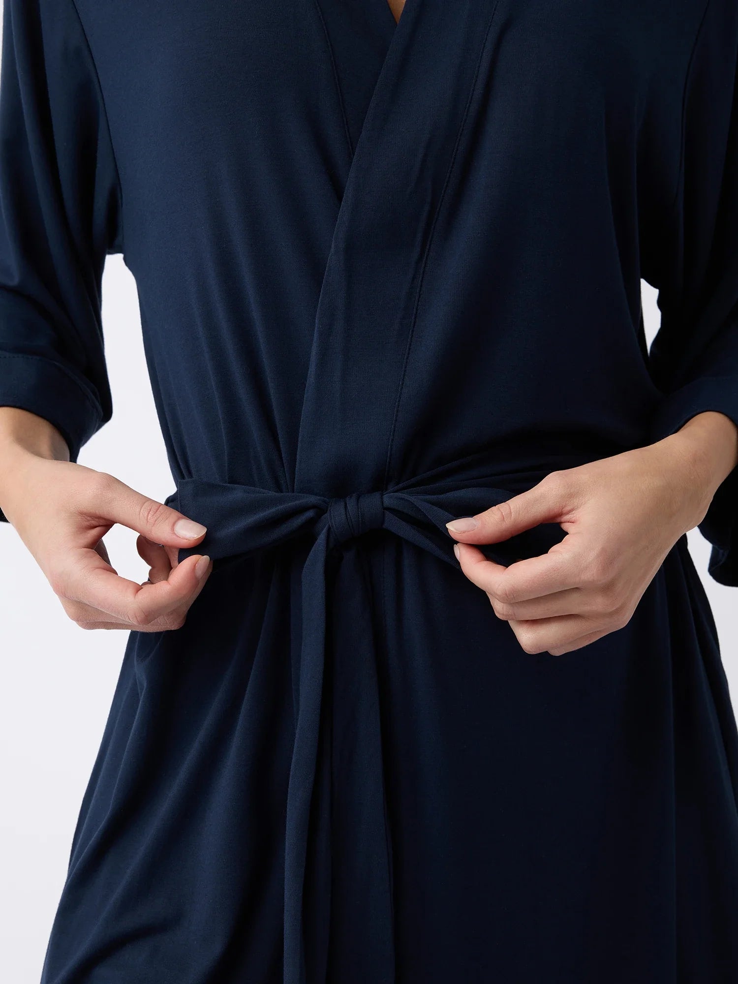 Navy@woman wearing a navy cozy earth robe