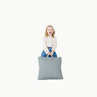 Amalfi (on sale) / Square@girl holding cushion