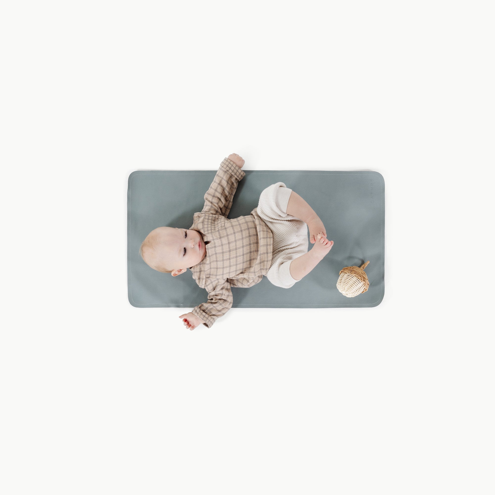 Amalfi (on sale)@overhead of baby laying on the amalfi micro+ mat