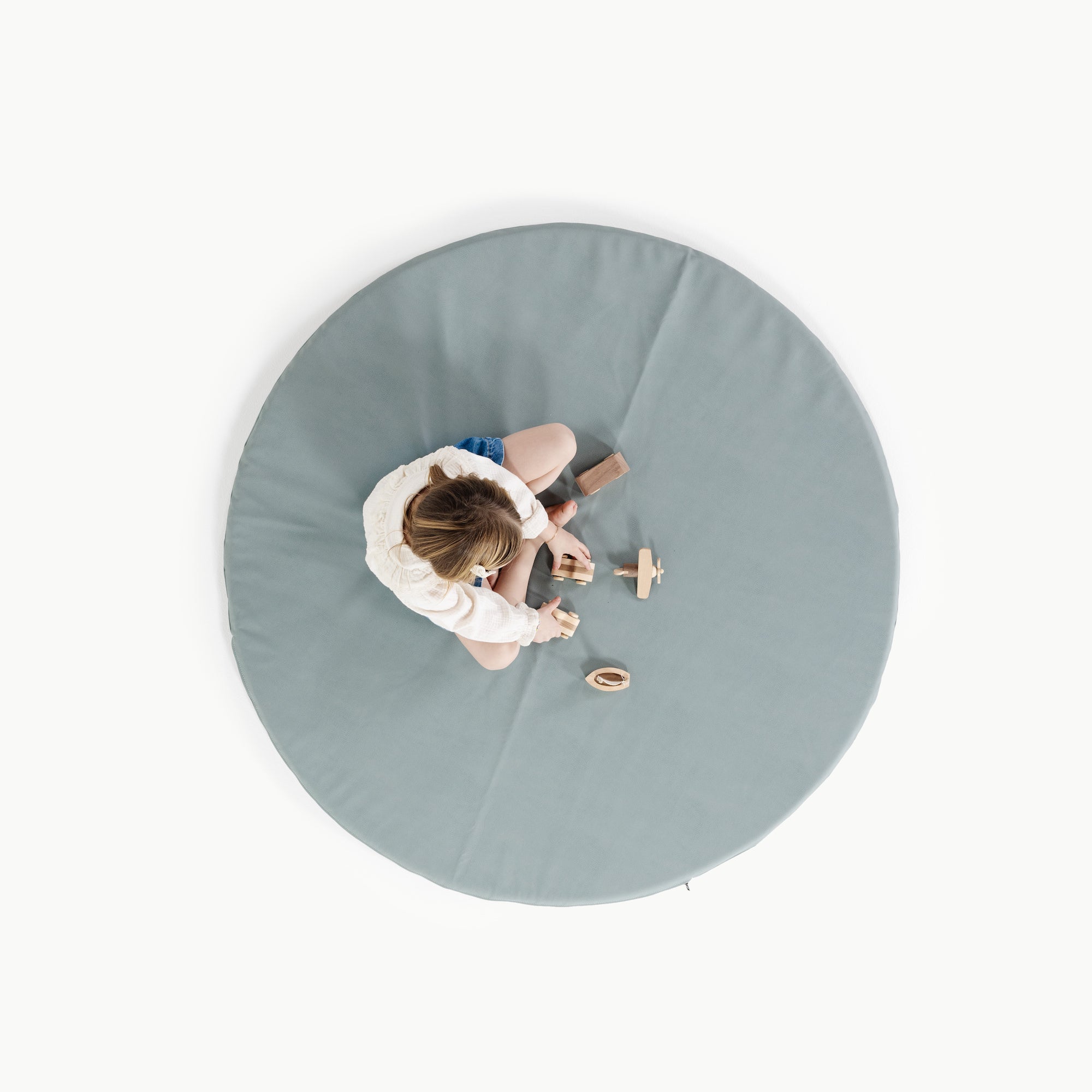 Amalfi (on sale)@overhead of little girl playing on mat