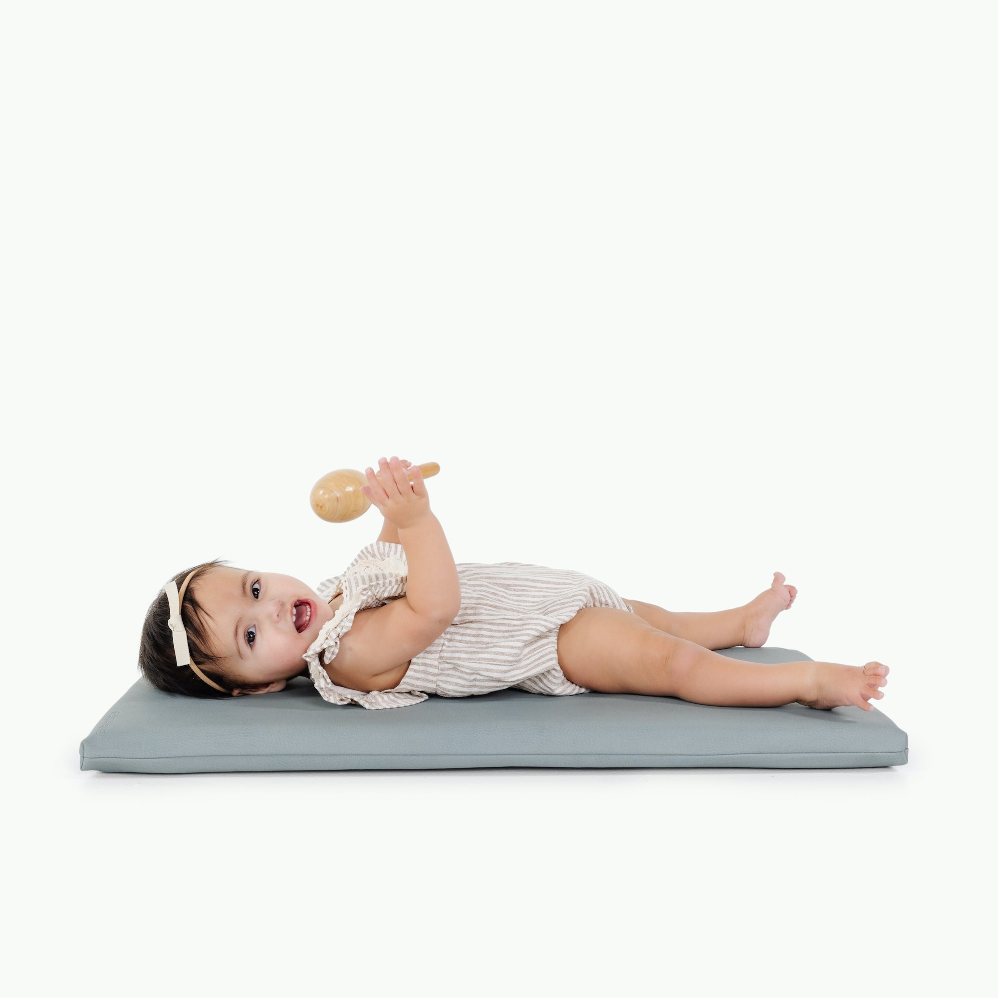 Amalfi (on sale)@little girl laying on padded mat