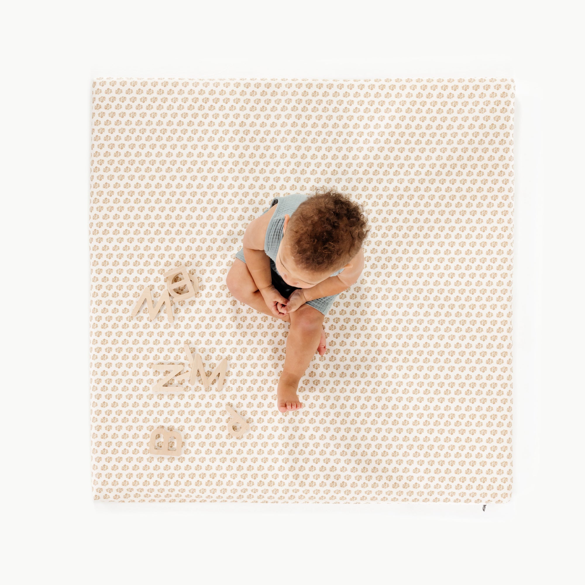 Bloom (on sale) / Square@overhead of baby playing on the bloom padded mini square