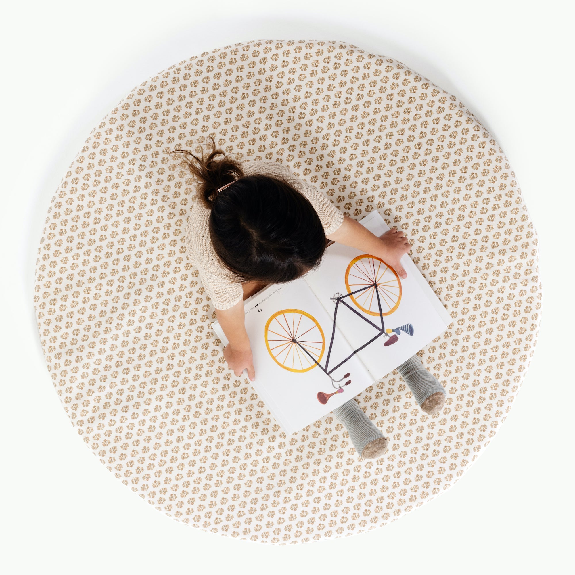 Bloom (on sale) / Circle@overhead image of girl reading book on bloom padded mini
