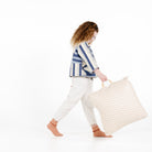 Bloom (on sale) / Square@kid holding the bloom mini square floor cushion