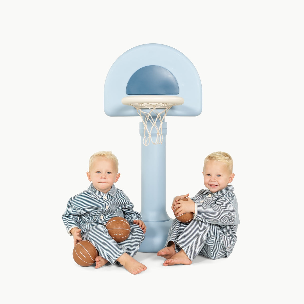 Quarry@Toddler using a basketball hoop to practice coordination and movement