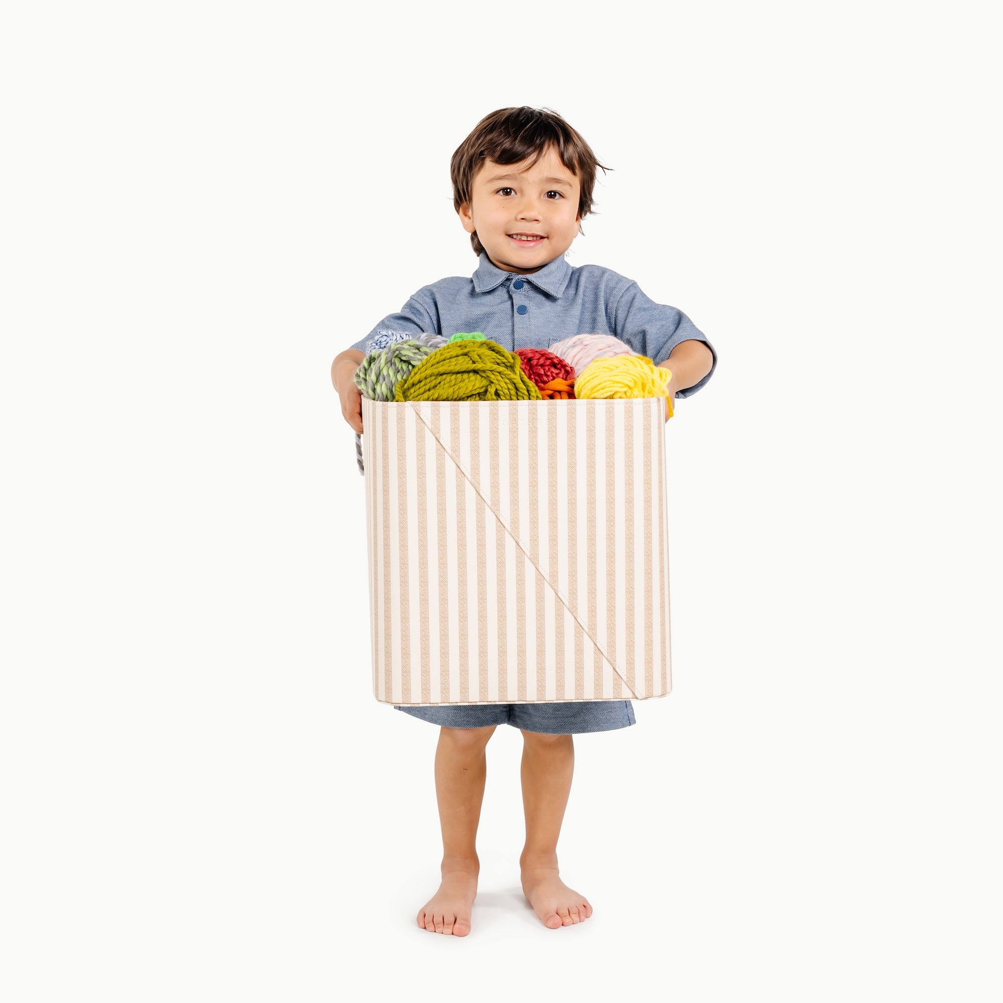 Cafe Stripe@boy holding medium storage bin