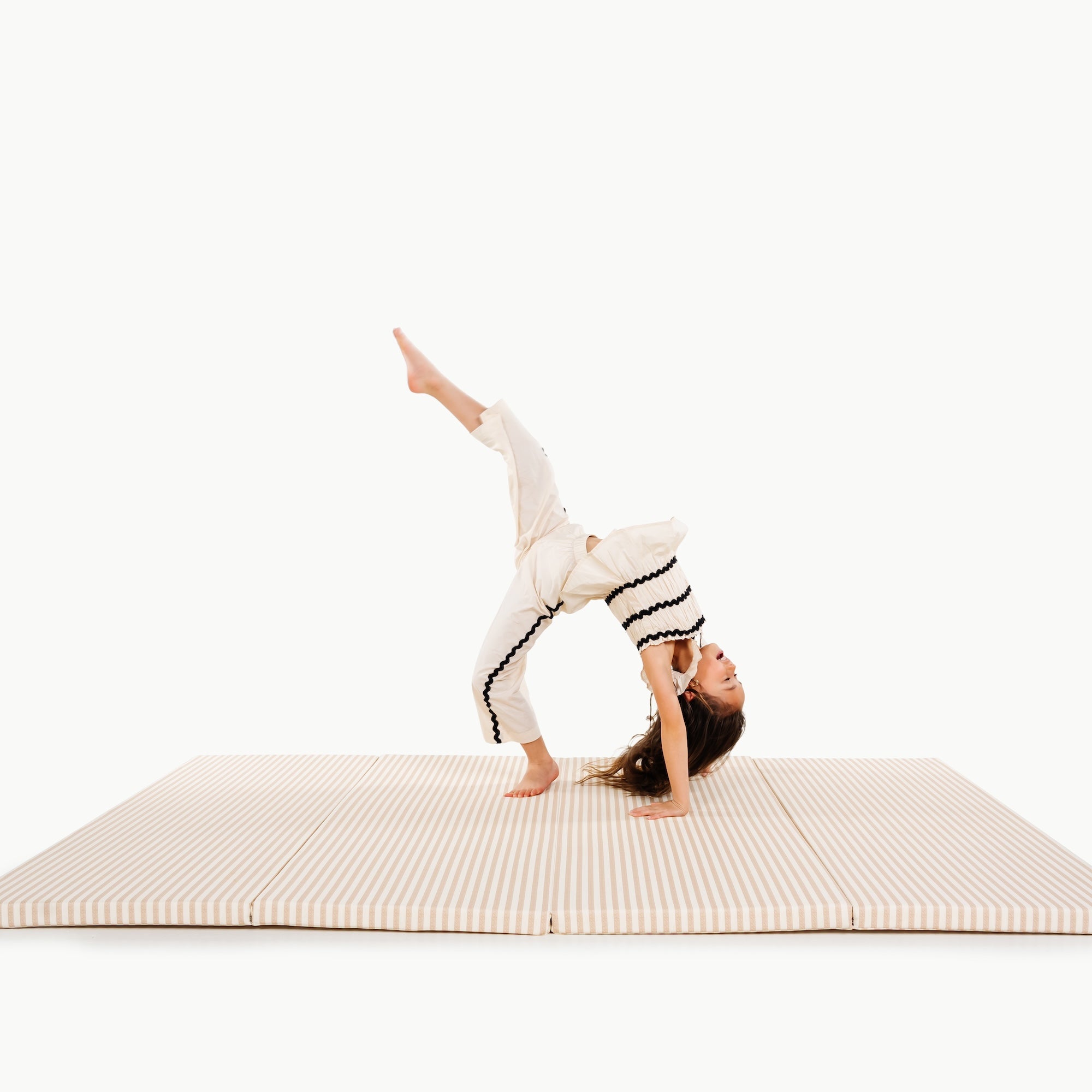 Cafe Stripe@kids playing on the cafe stripe tumbling mat