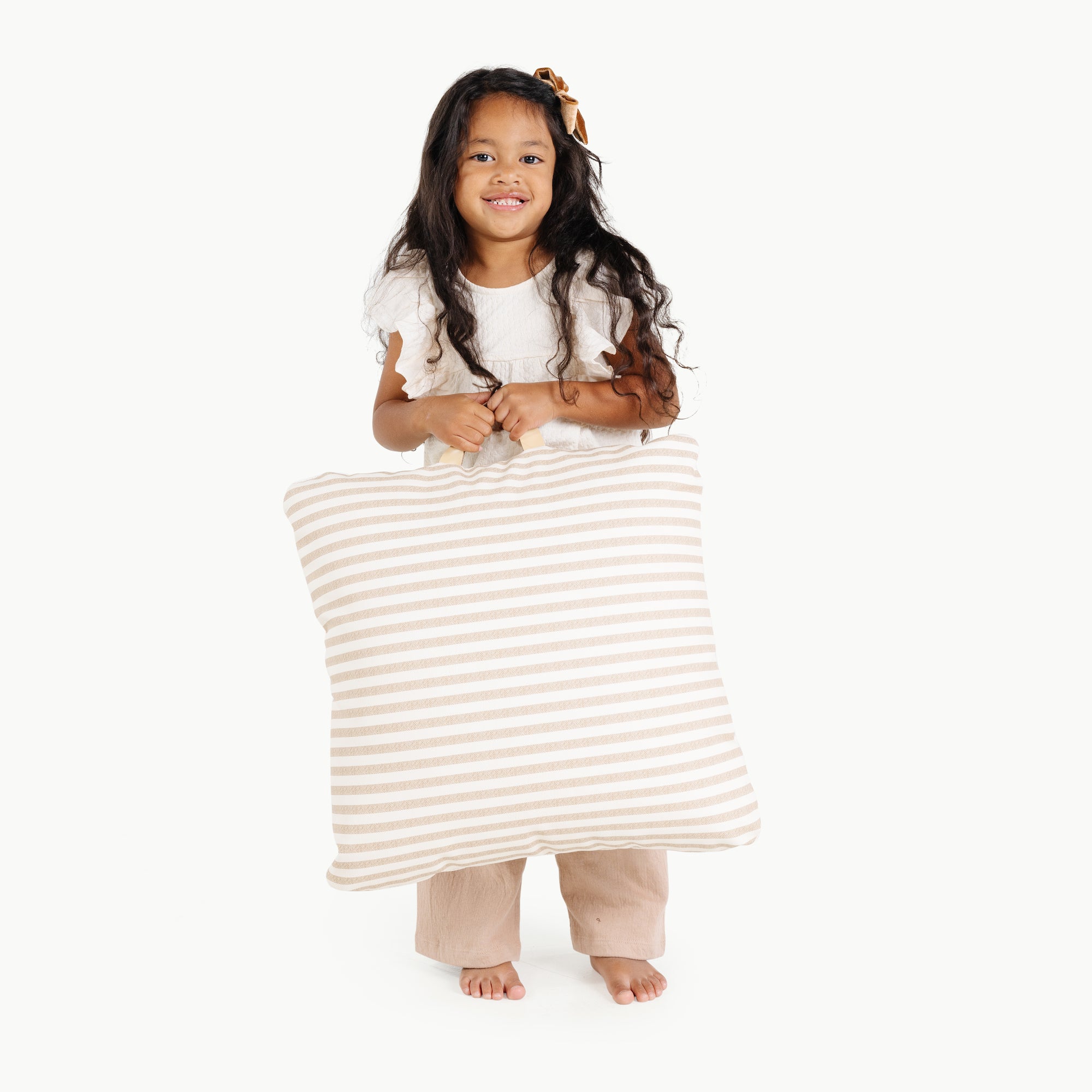 Cafe Stripe / Square@kid holding the cafe stripe mini square floor cushion