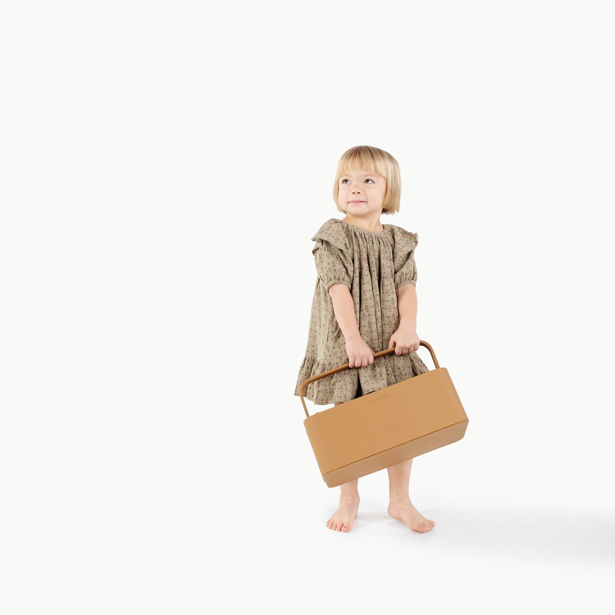 Camel@kid holding the small camel caddy