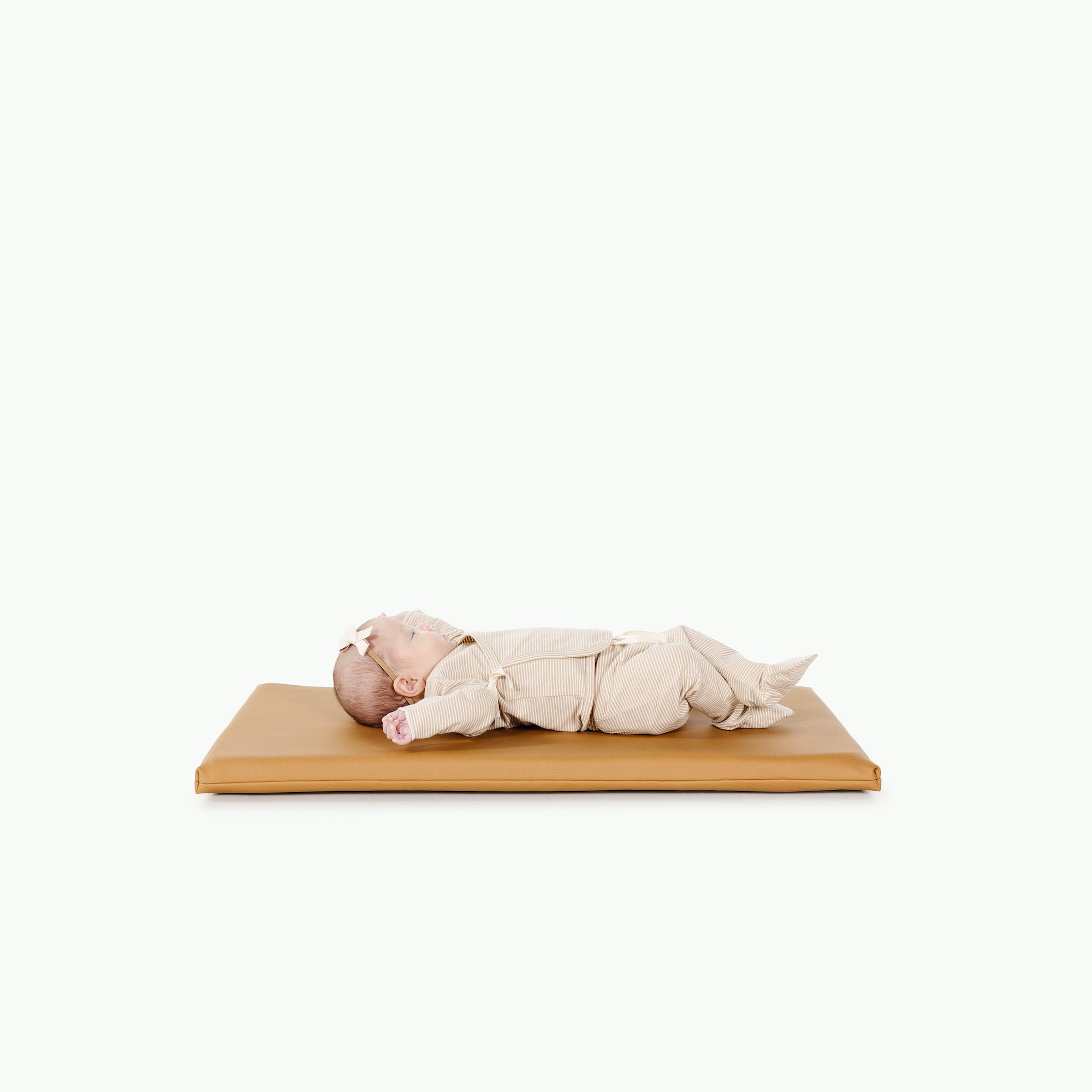 Camel@Baby laying on camel padded micro+