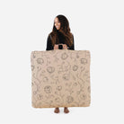 Peony (on sale) / Square@woman holding up the peony square floor cushion