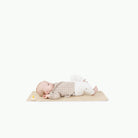 Créme (on sale)@baby laying on the créme micro+ mat