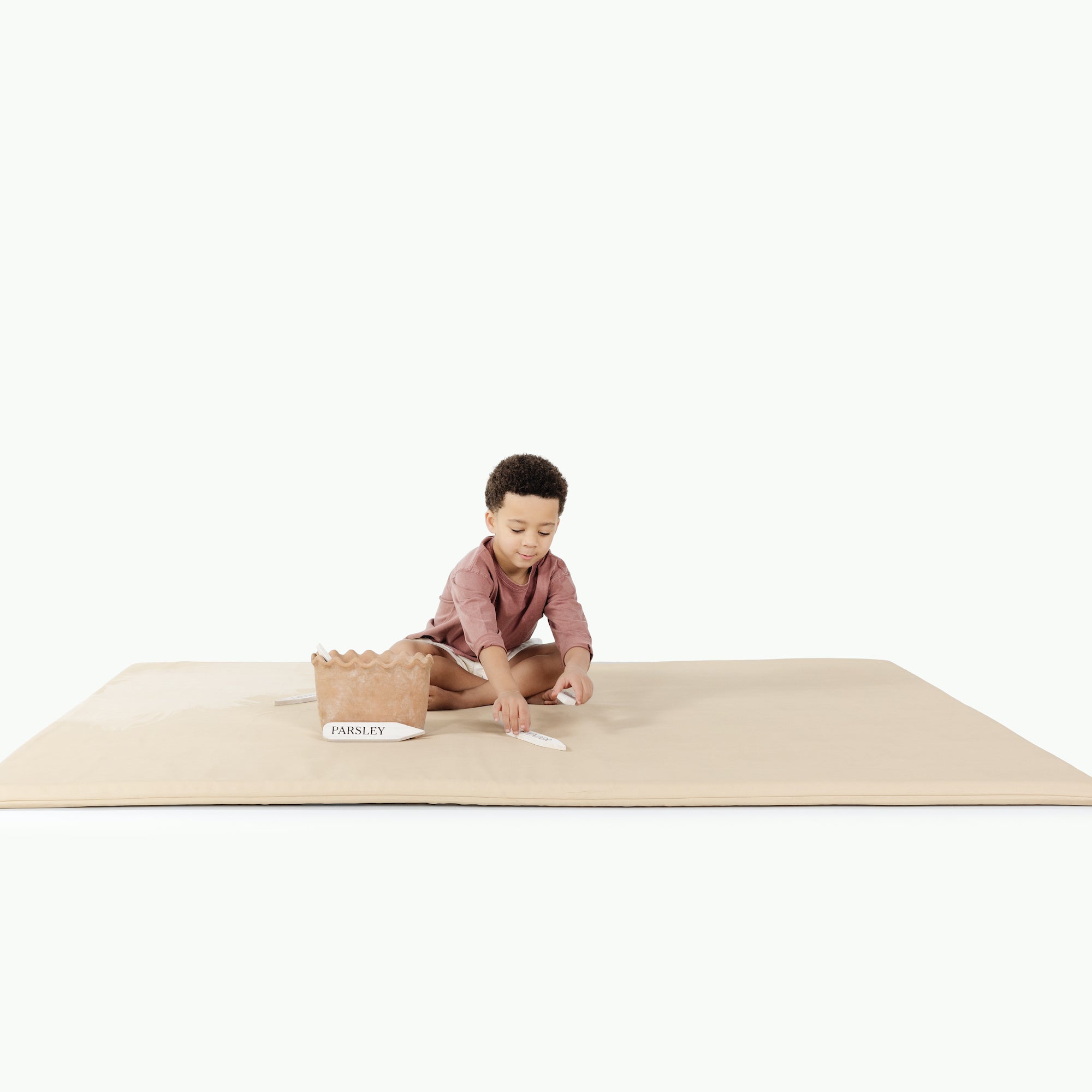 Créme (on sale)@little boy on padded mat