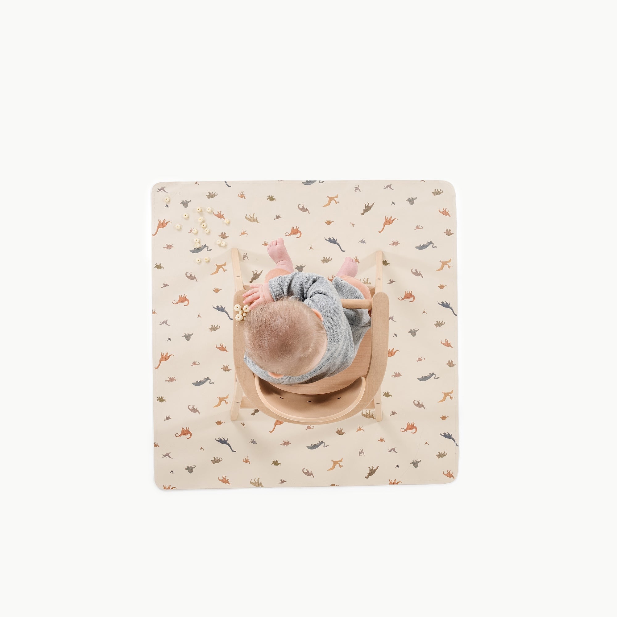 Dinosauria@overhead of baby in a highchair