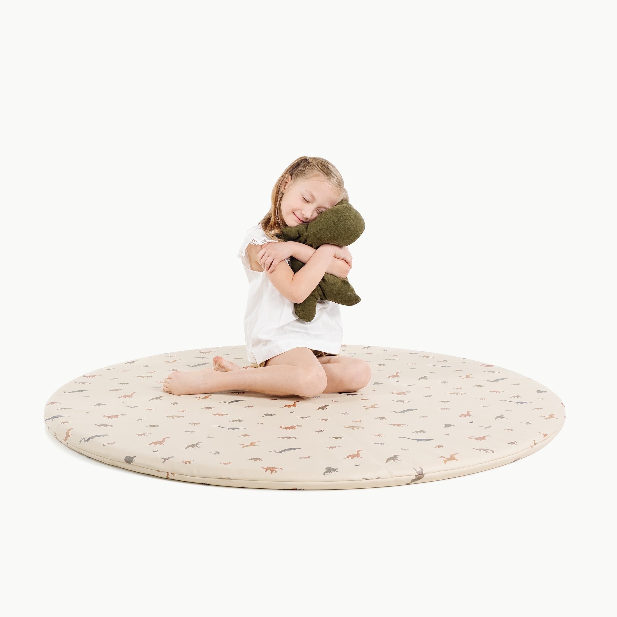 Dinosauria (on sale)@little girl sitting on padded midi