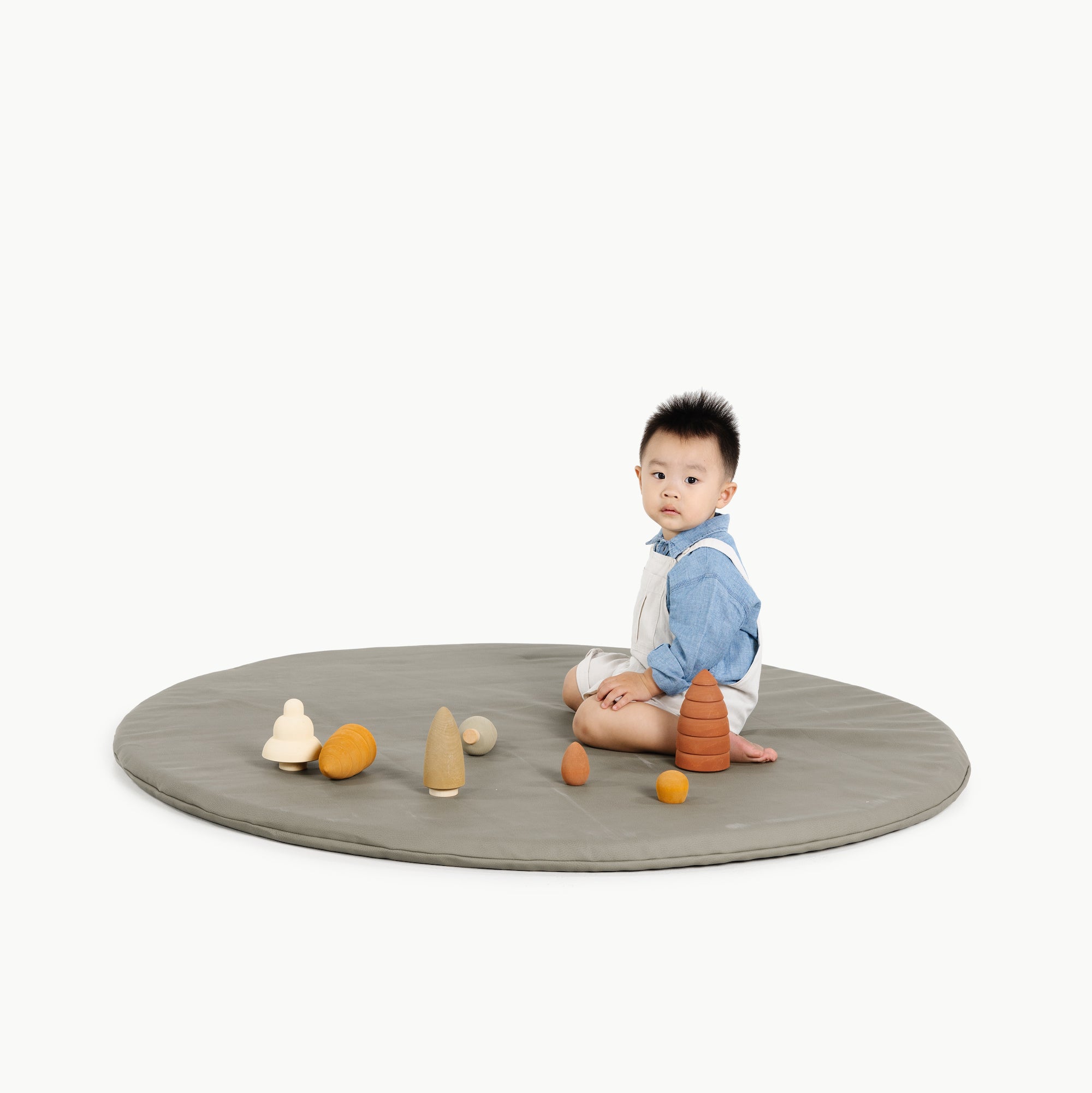 Fern (on sale)@kid playing on the fern padded midi circle