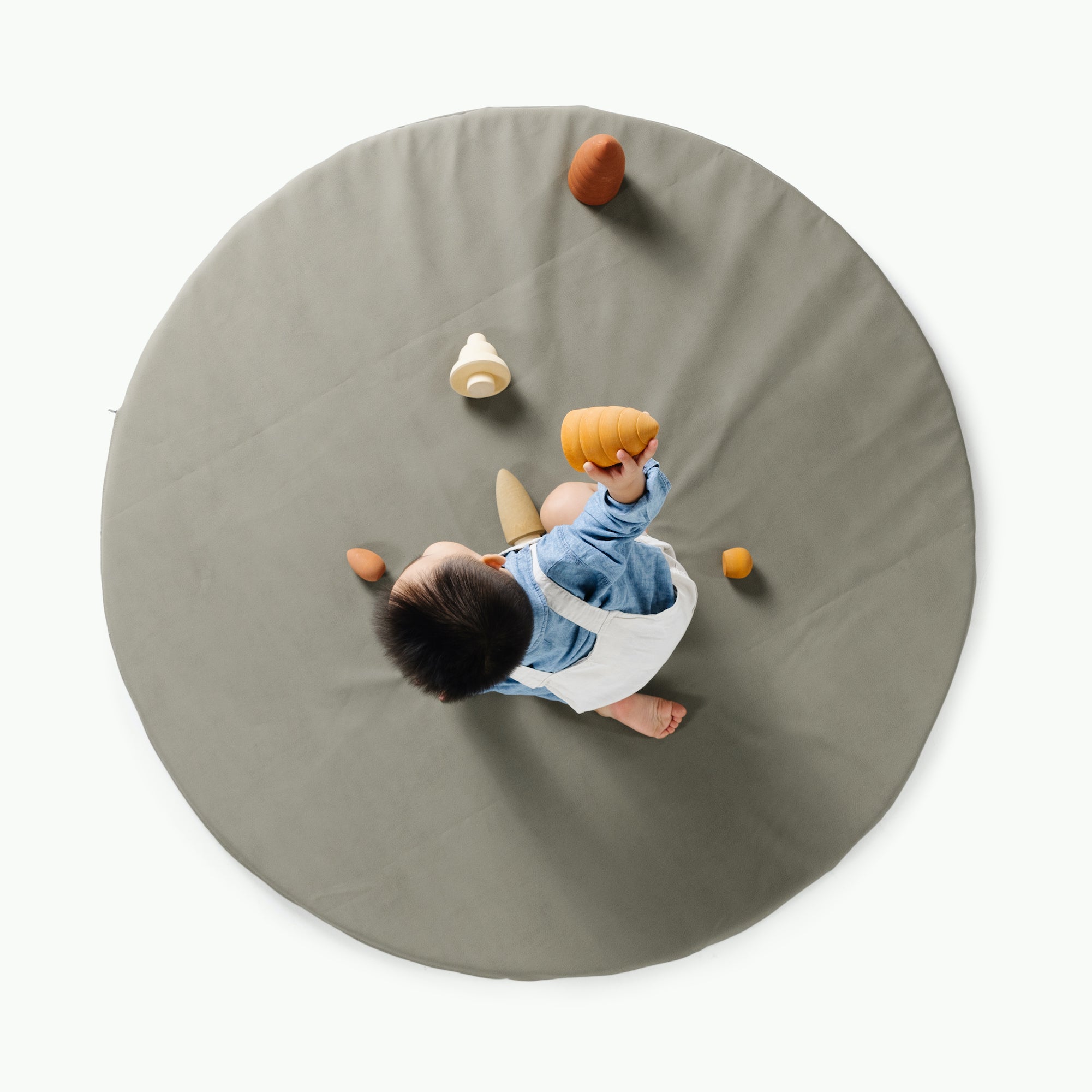 Fern (on sale)@overhead of kid playing on the fern padded midi circle