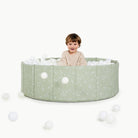 Flora@toddler playing in ball pit