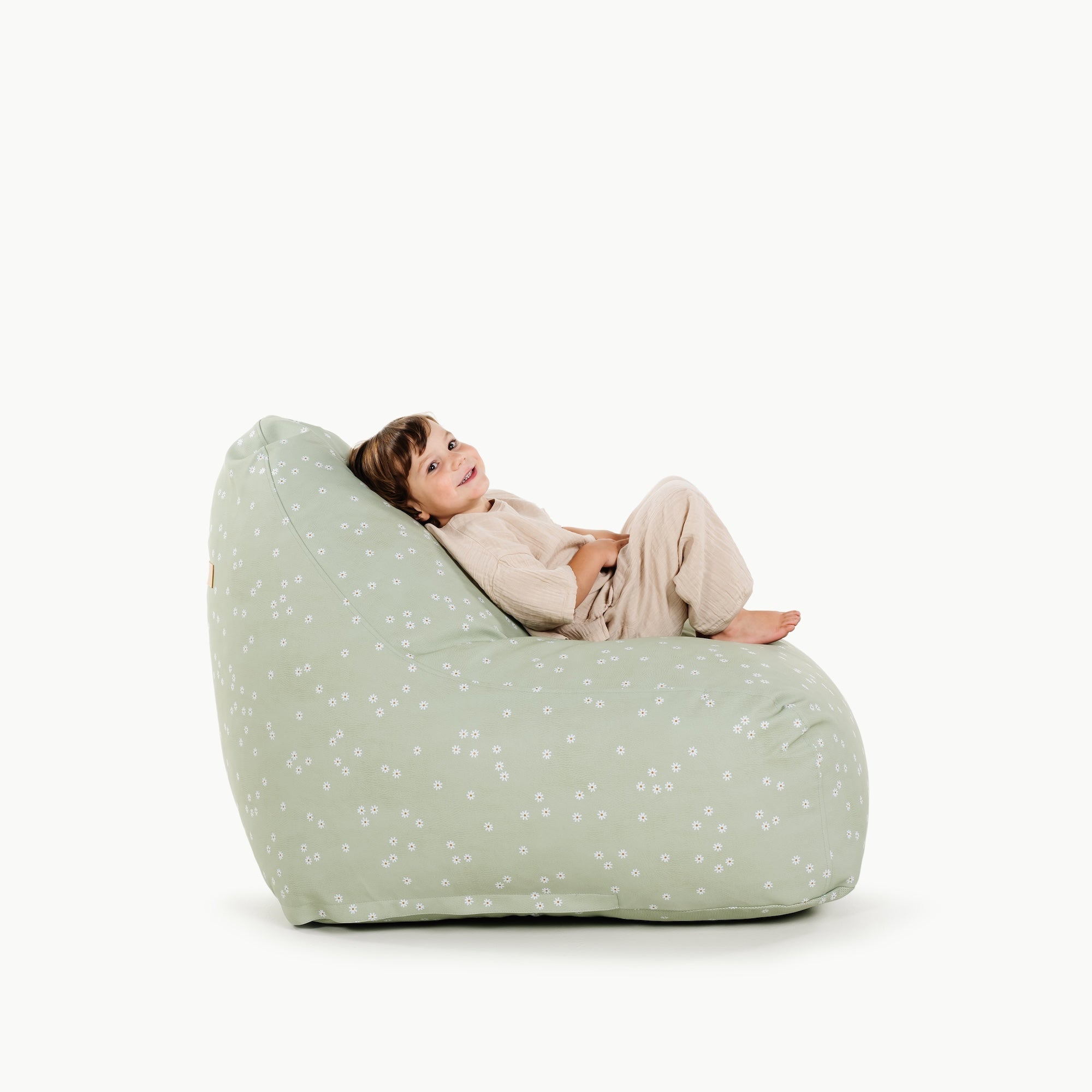 Flora@toddler sitting on lounger