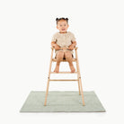 Flora@girl in high chair on mini mat