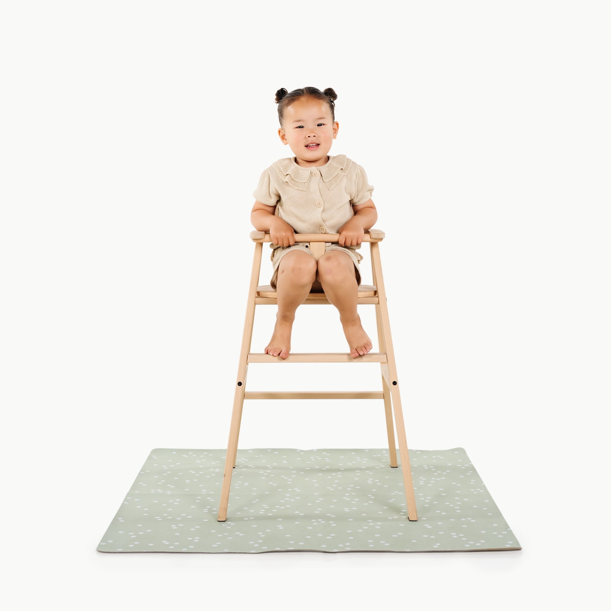 Flora@girl in high chair on mini mat