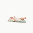 Flora@baby lying on a micro changing mat