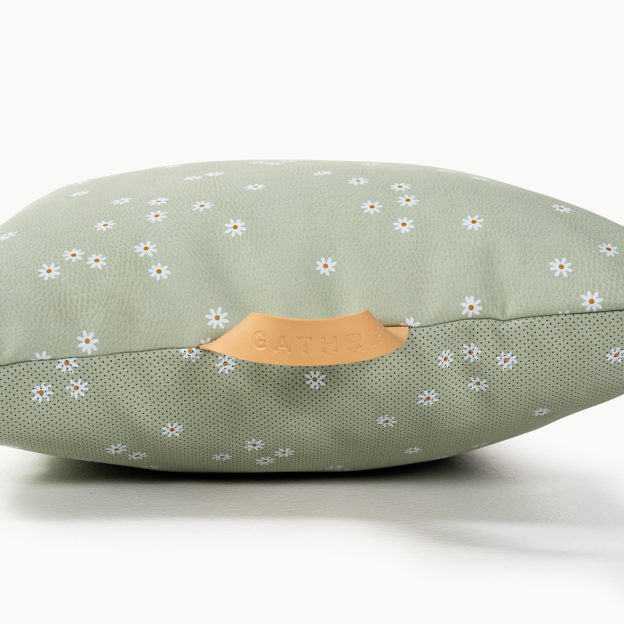 Flora / Square@handle detail on a mini cushion