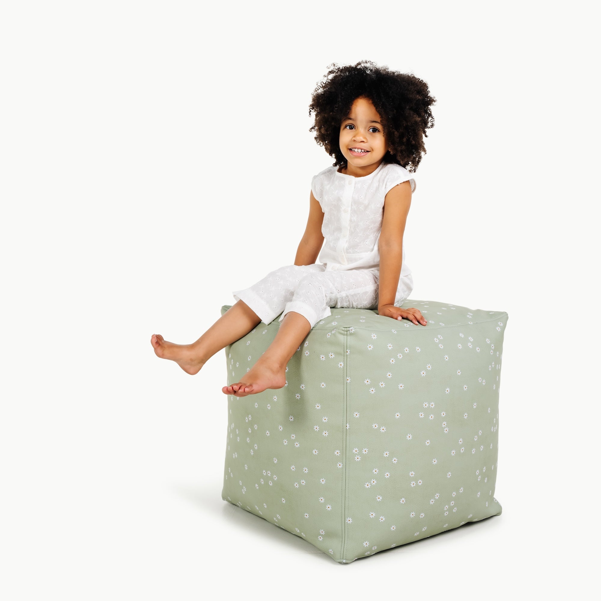 Flora (on sale)@little girl sitting on pouf
