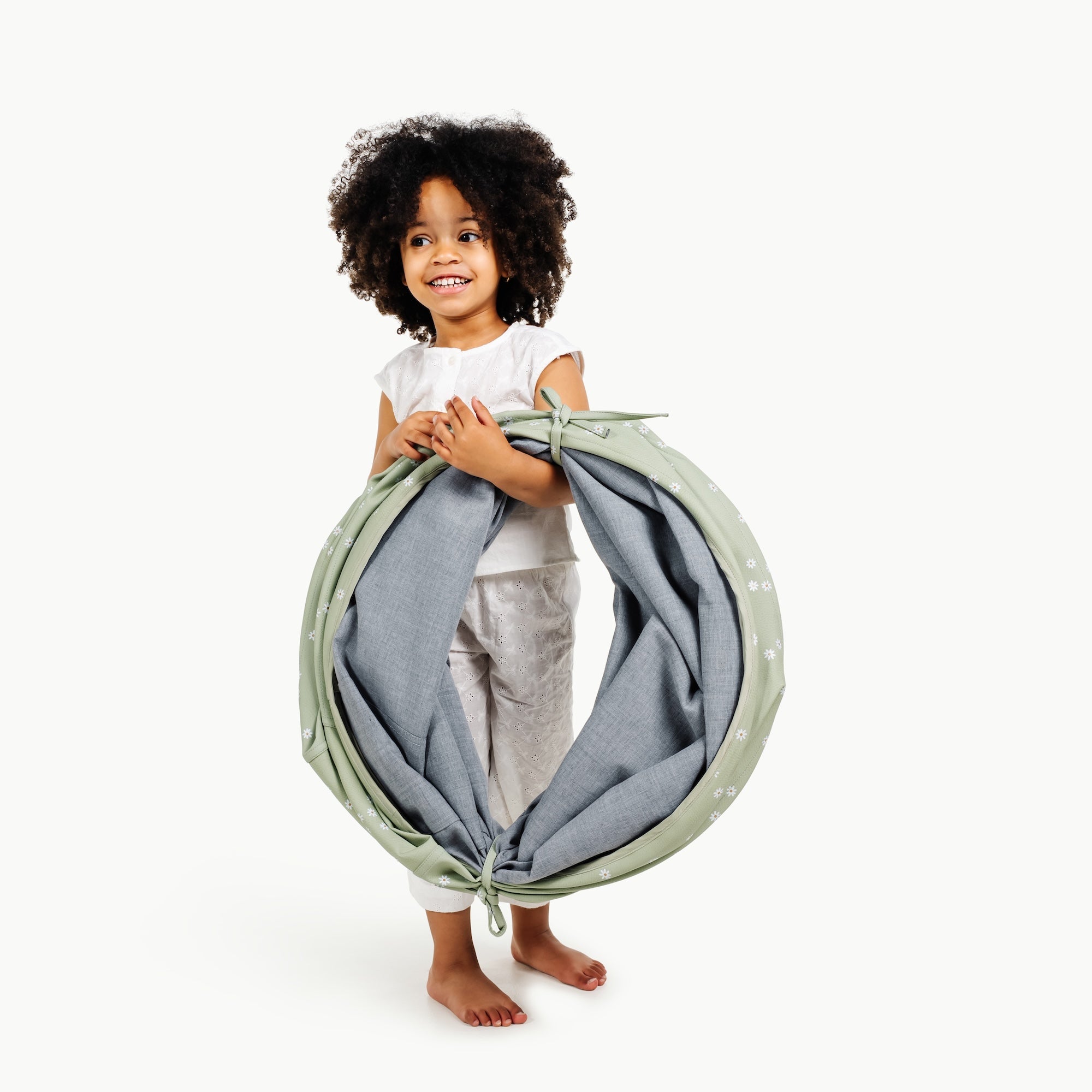 Flora@toddler holding folded tunnel