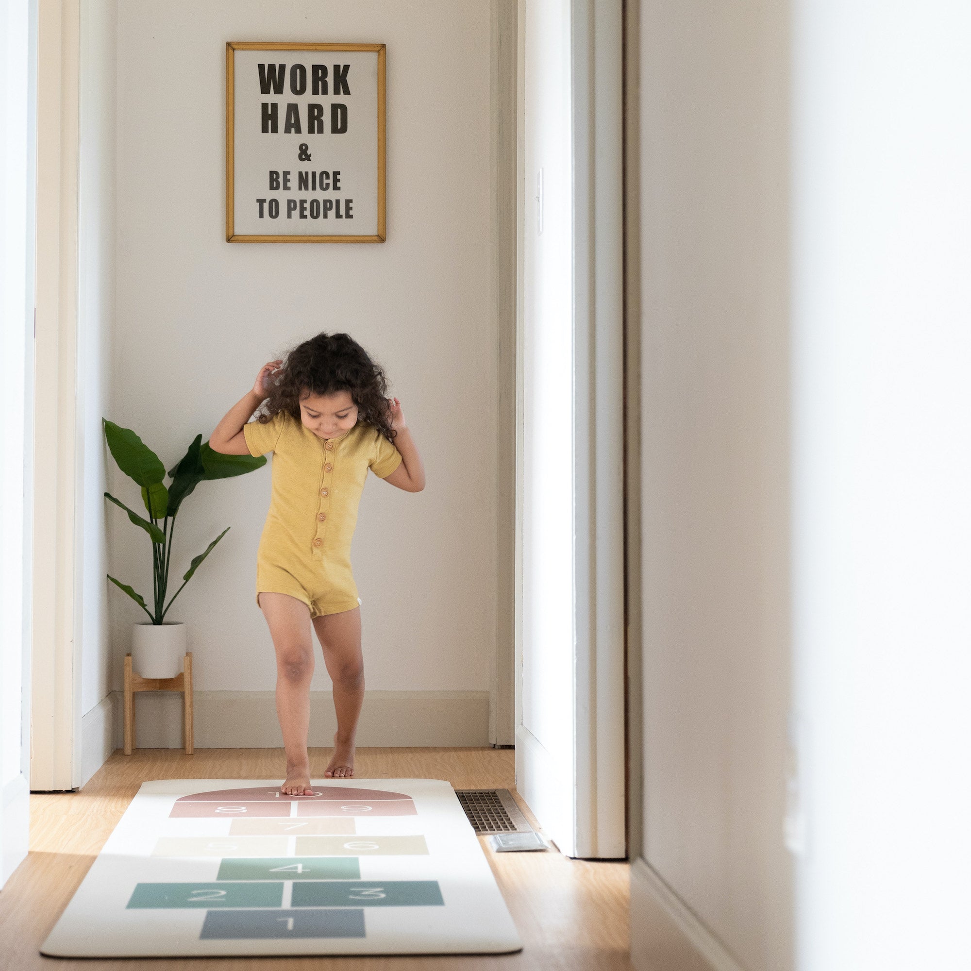 Rainbow Hopscotch@kid playing on the rainbow hopscotch mat