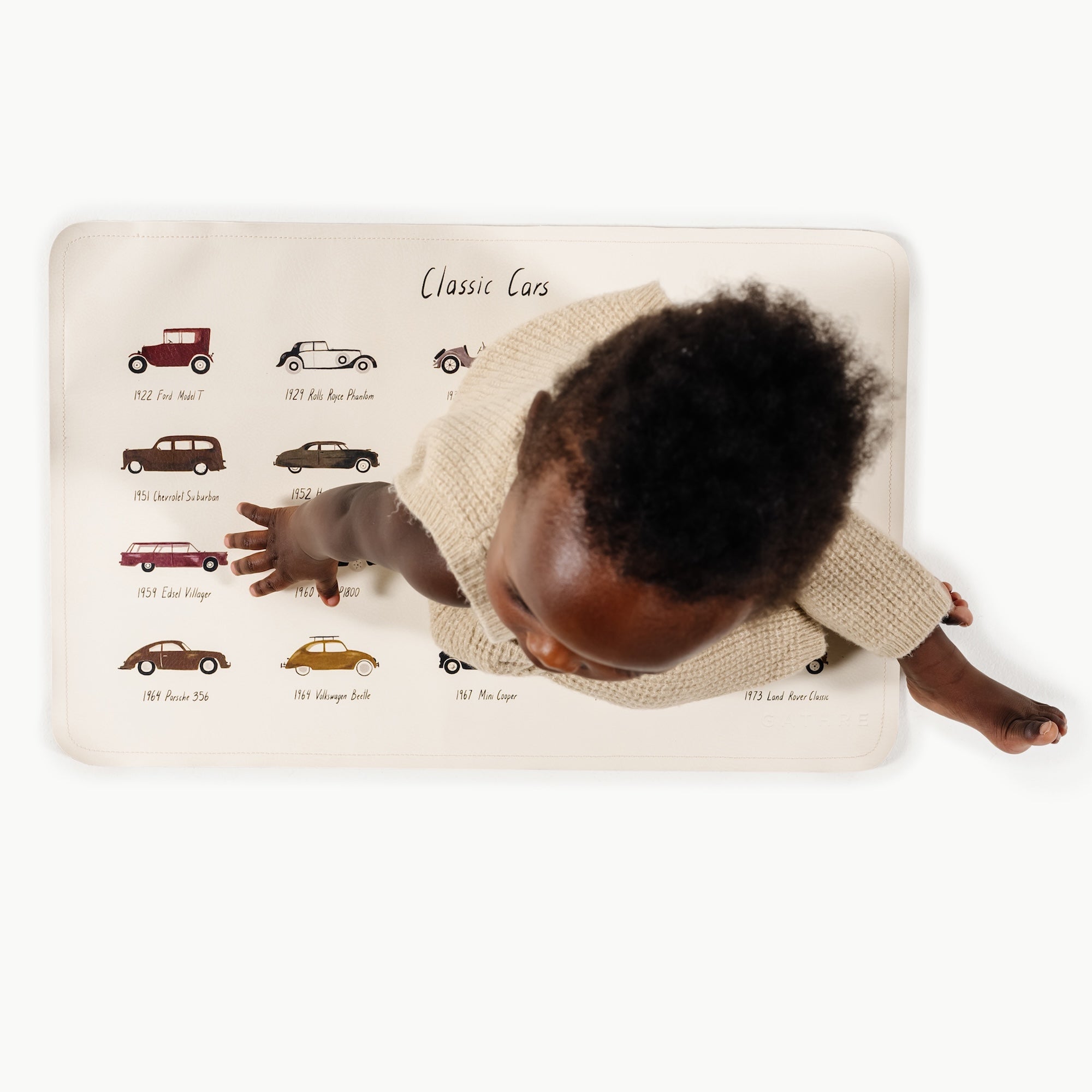 Classic Cars@overhead of baby boy sitting on micro mat