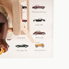 Classic Cars@little boy in a high chair on a mini mat