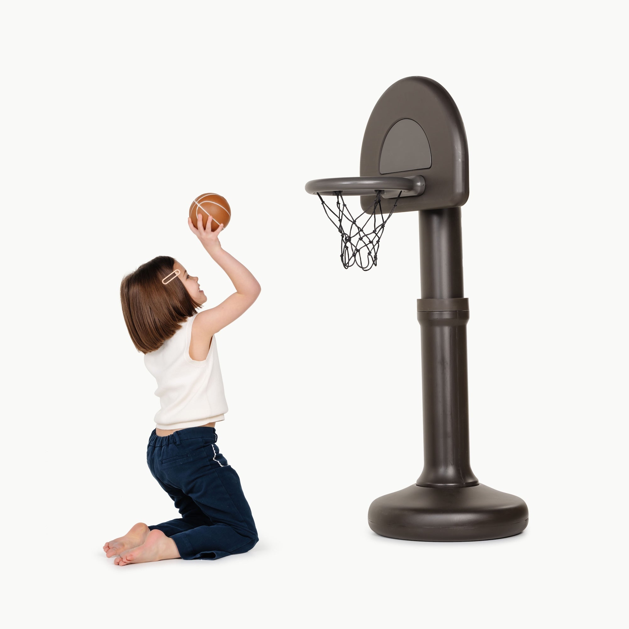 Raven@Toddler using a basketball hoop to practice coordination and movement