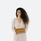 Camel Dash (on sale) / Circle@woman holding the camel dash midi circle mat folded up