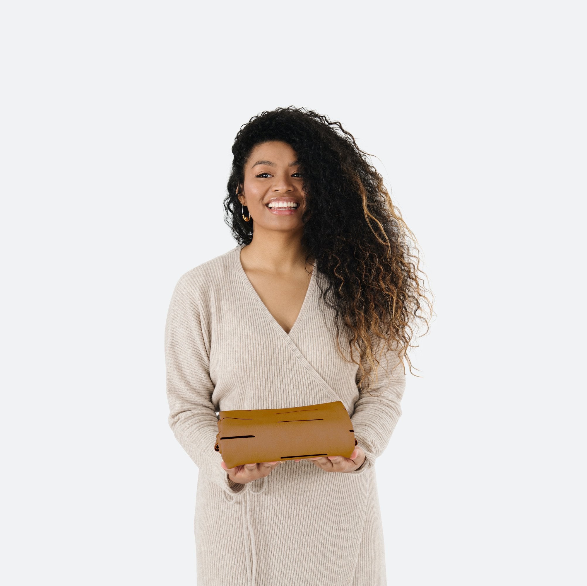 Camel Dash (on sale) / Circle@woman holding the camel dash midi circle mat folded up