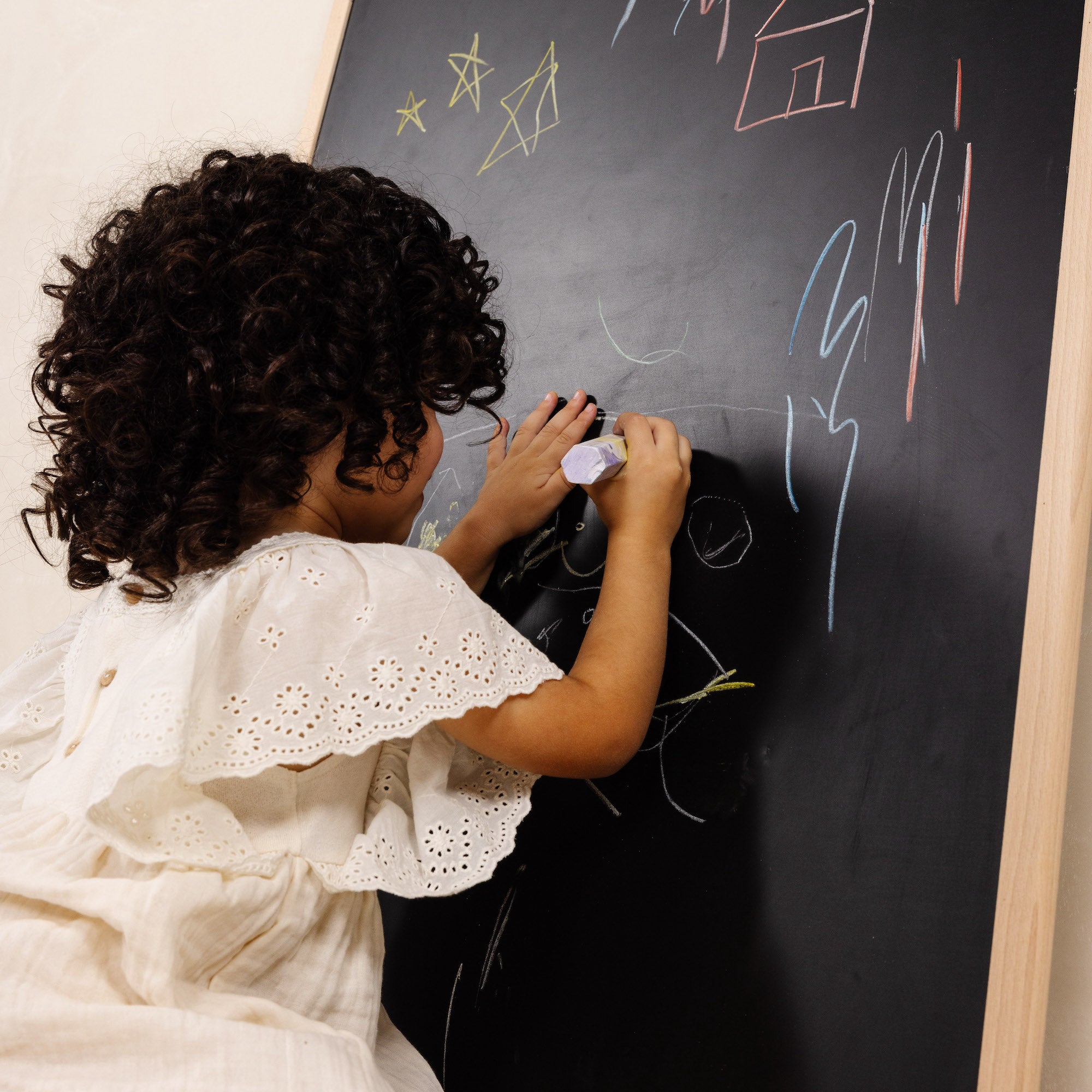 Beech@Kid drawing on the chalkboard side of the Chalkboard