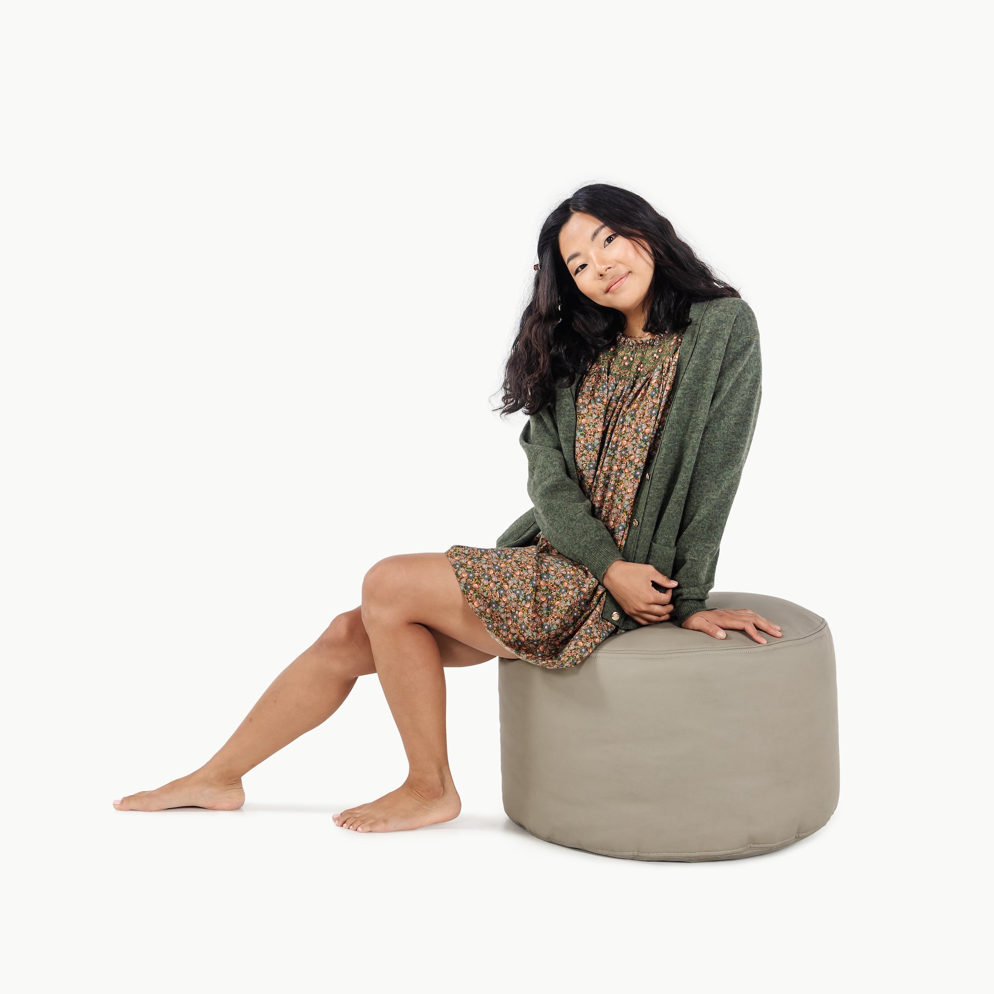 Grove (on sale)@woman sitting on the grove circle pouf