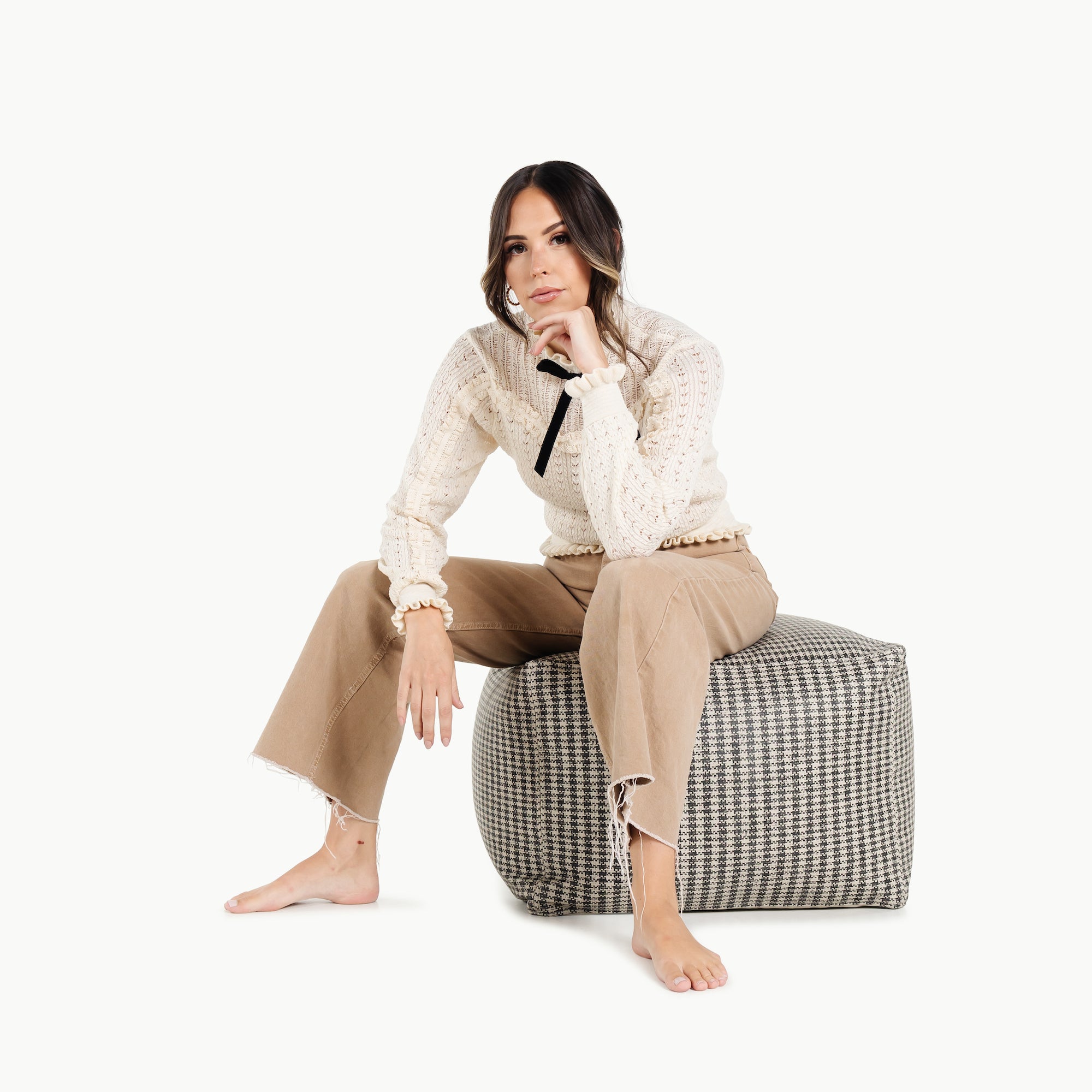Houndstooth (on sale)@woman sitting on the houndstooth square pouf