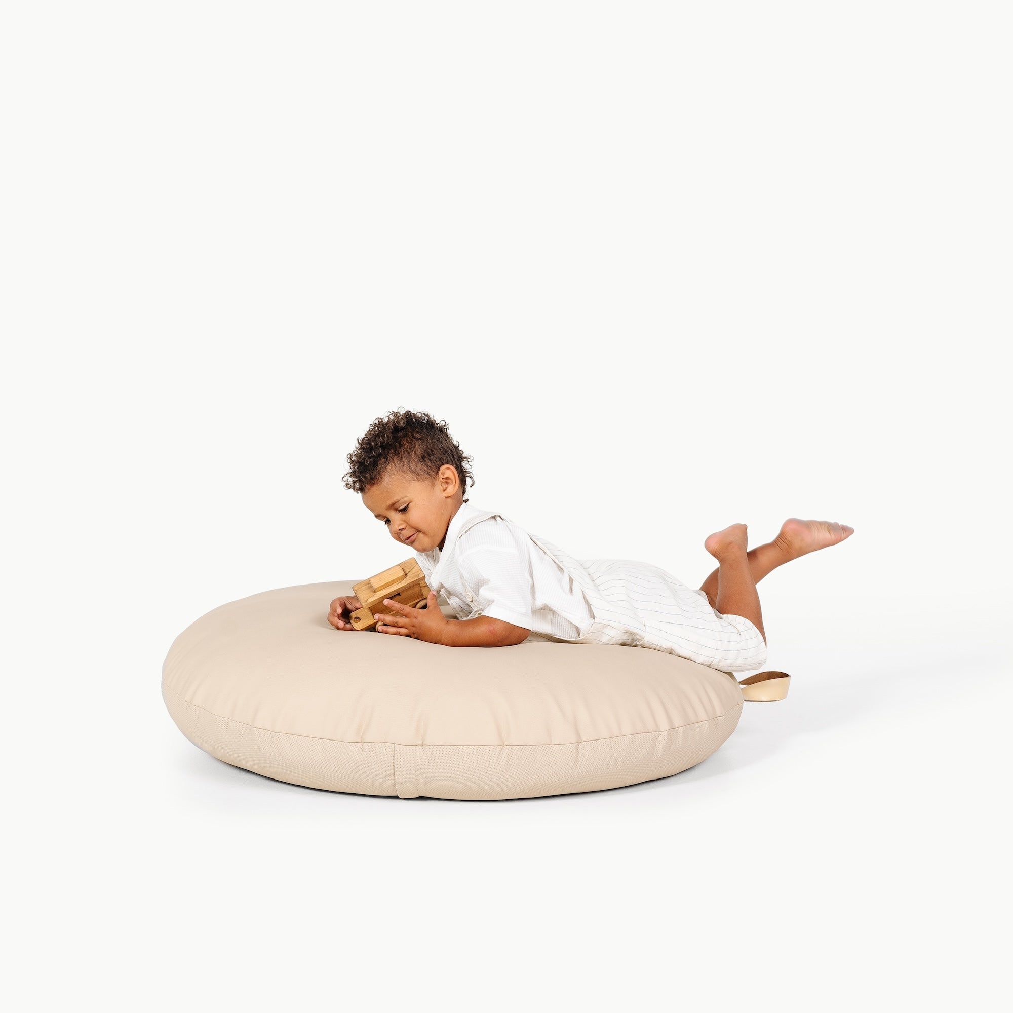 Ivory / Circle@little boy playing on the Ivory Circle Floor Cushion