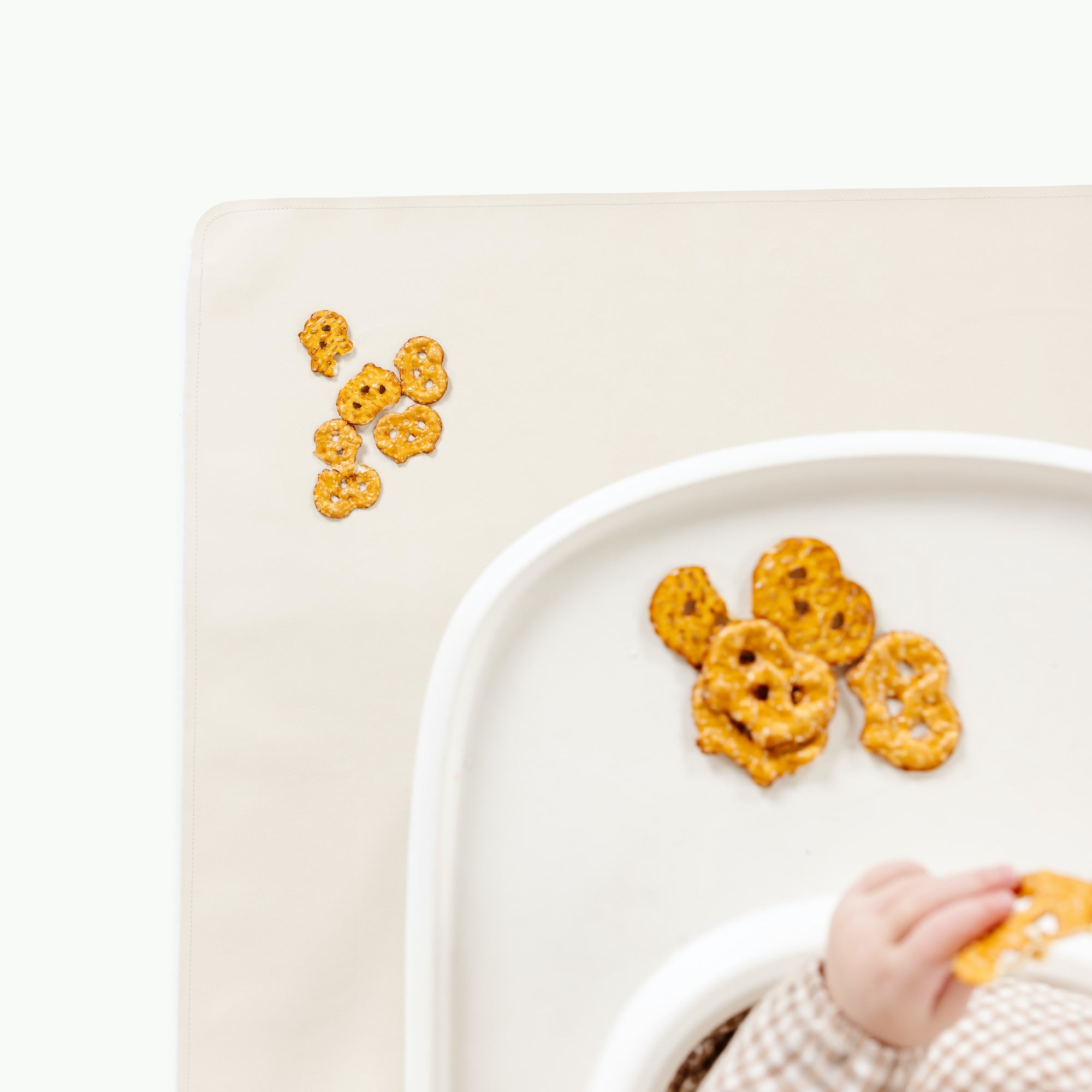 Ivory@Overhead baby sitting on the Ivory Mini Mat