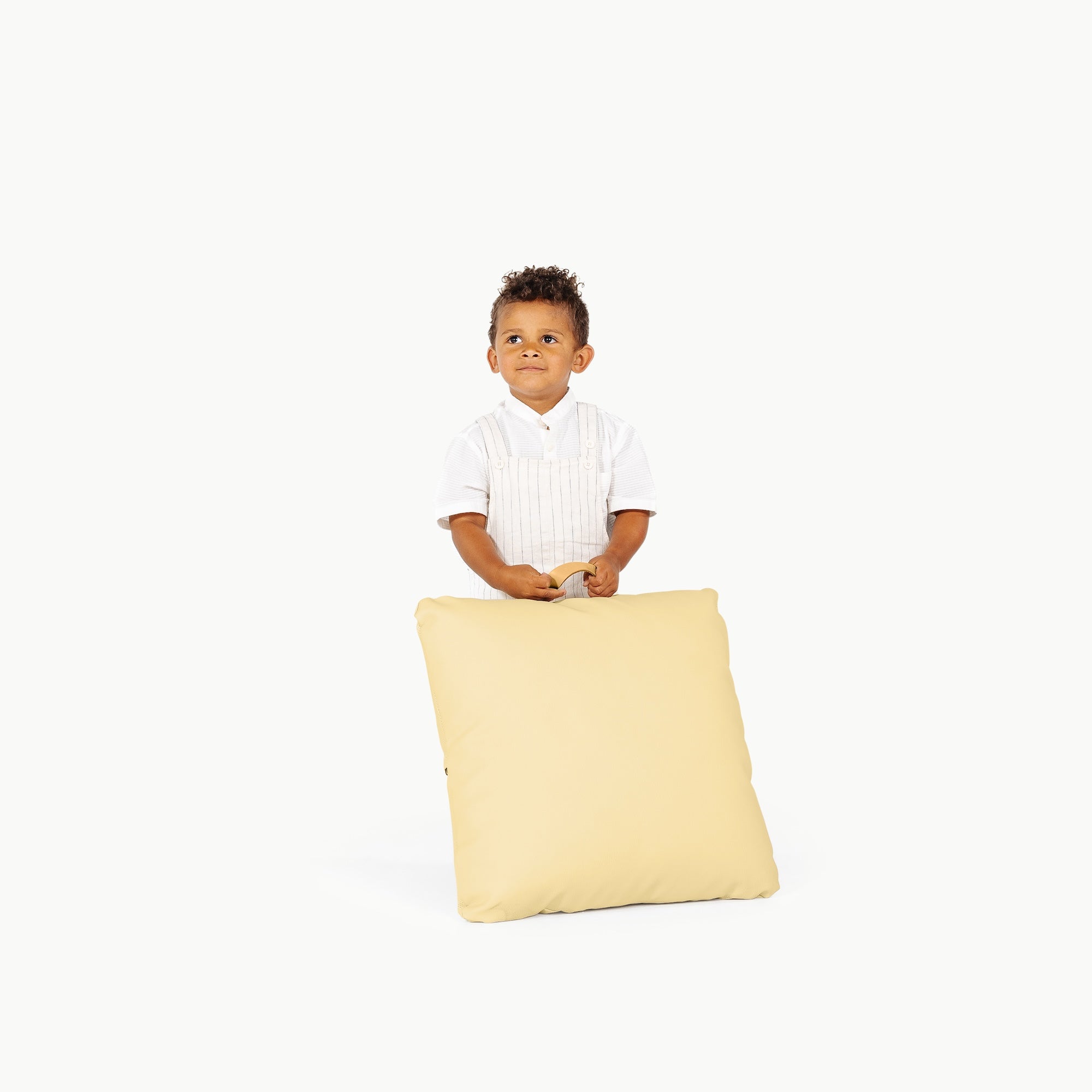 Mellow/ Square@little boy holding a mini cushion