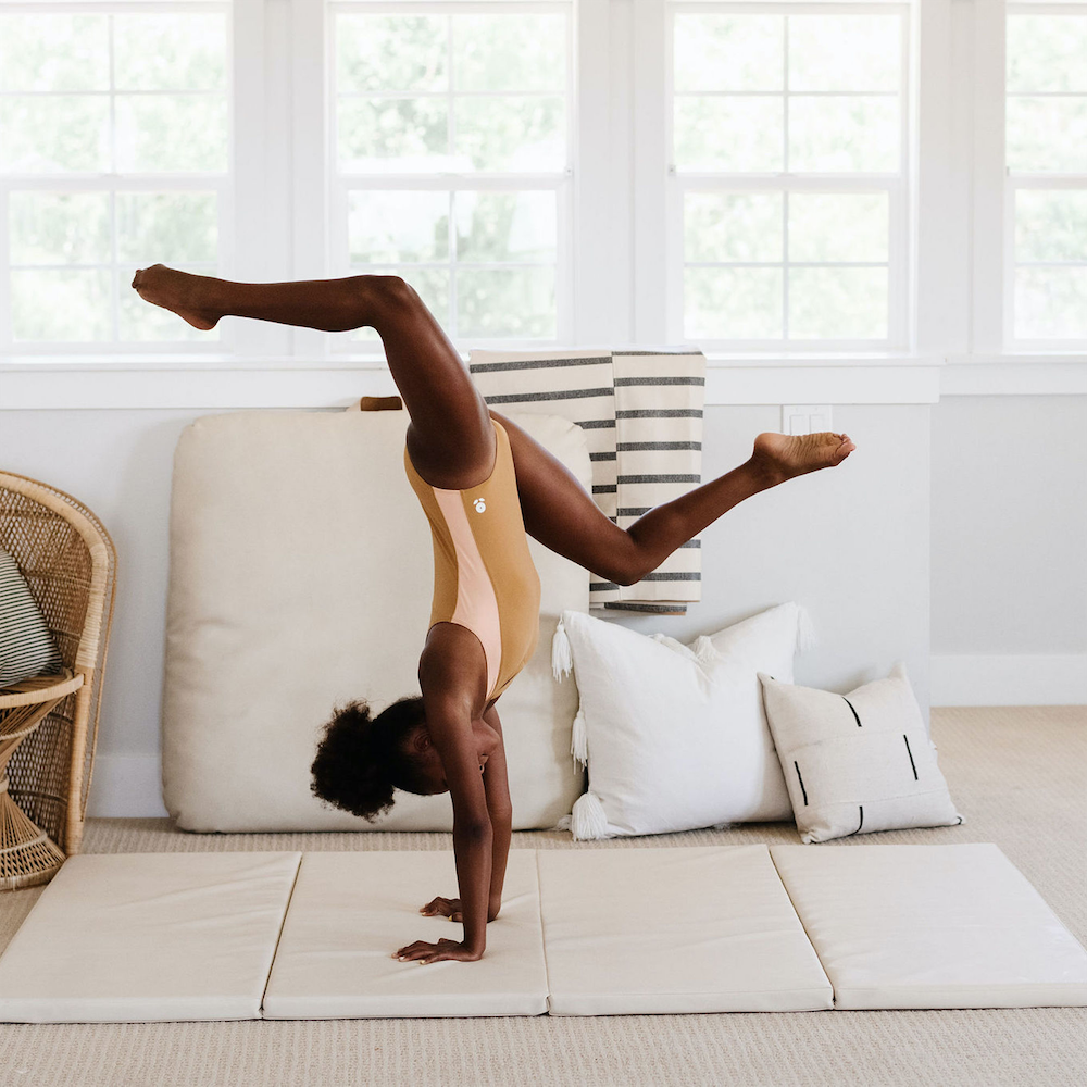Ivory@Girl doing a handstand on the Ivory Tumbling Mat