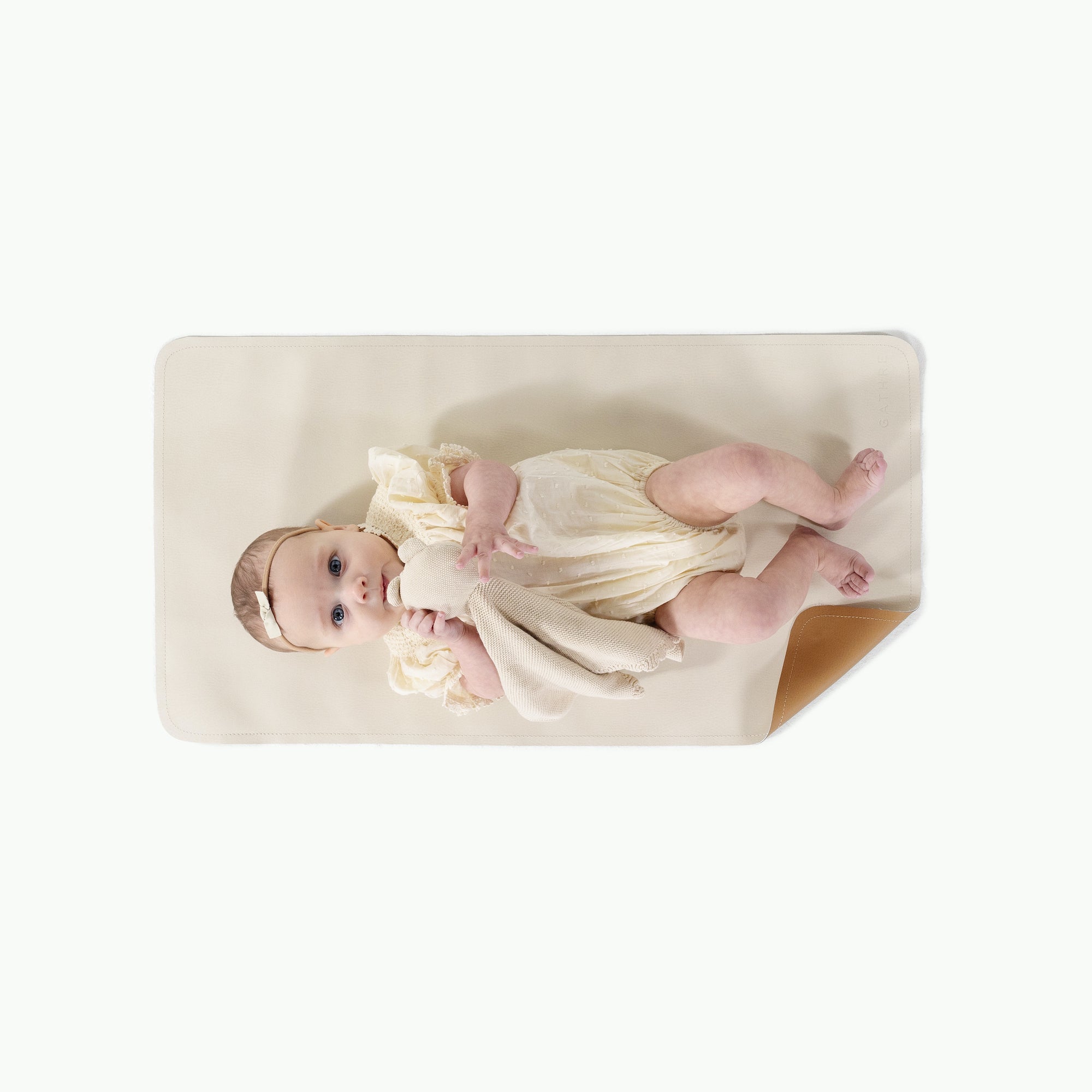 Camel • Ivory (on sale)@overhead of baby girl on mat