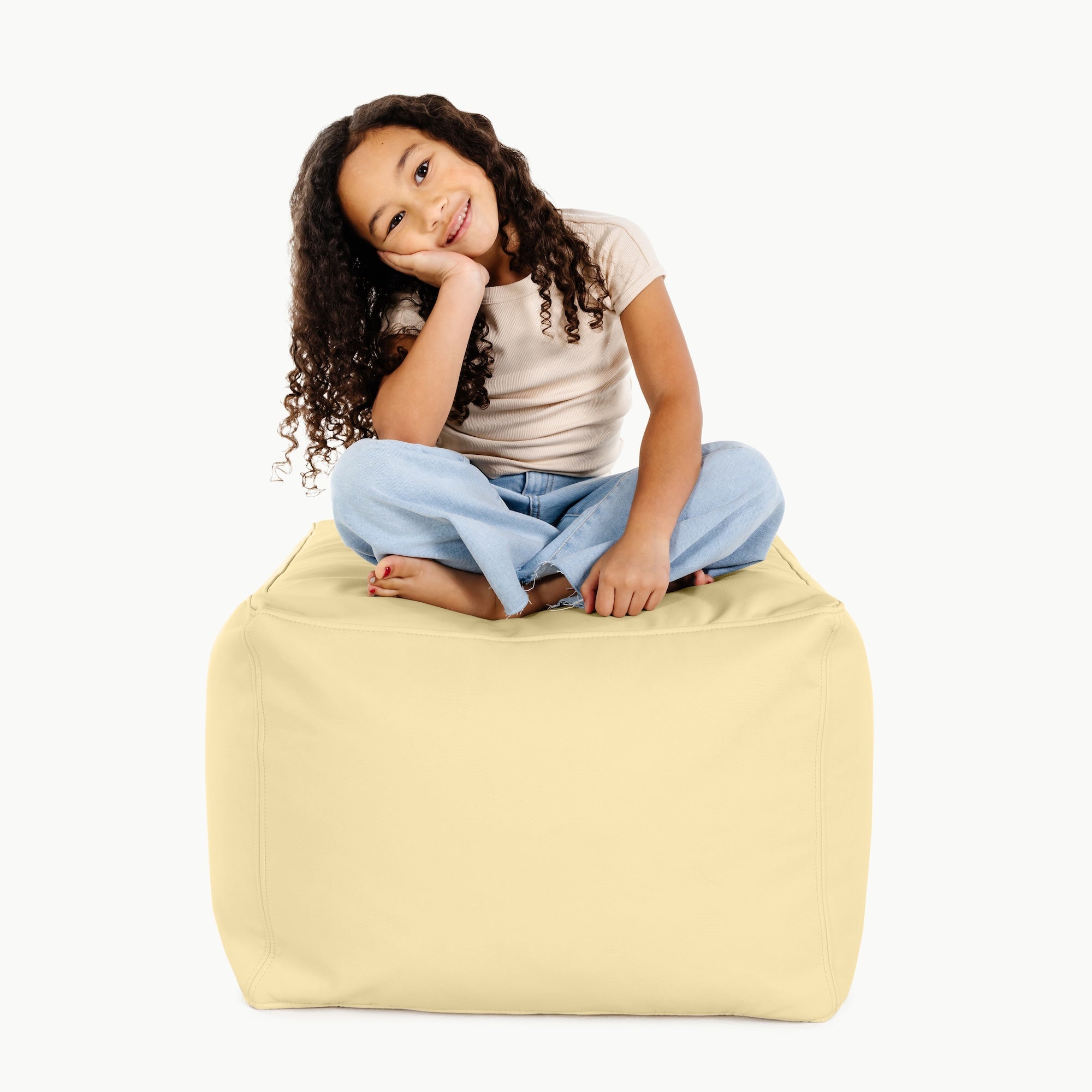 Mellow@little girl sitting on pouf