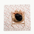 London@overhead of kid in a highchair on the london mini mat