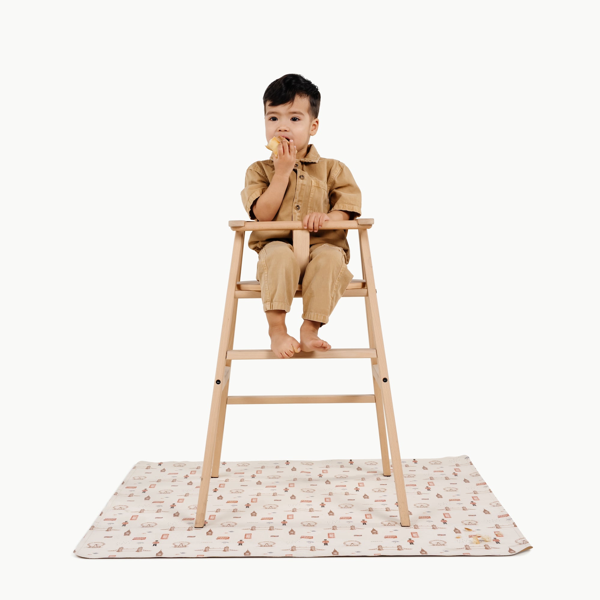 London@kid in a highchair on the london mini mat
