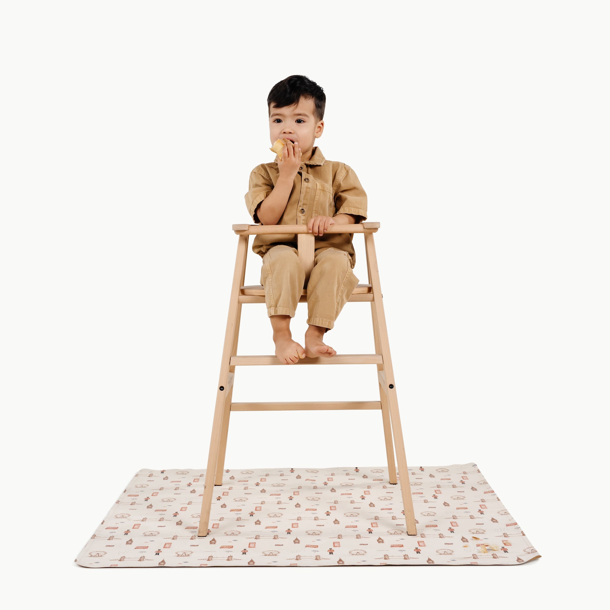 London (on sale)@kid in a highchair on the london mini mat