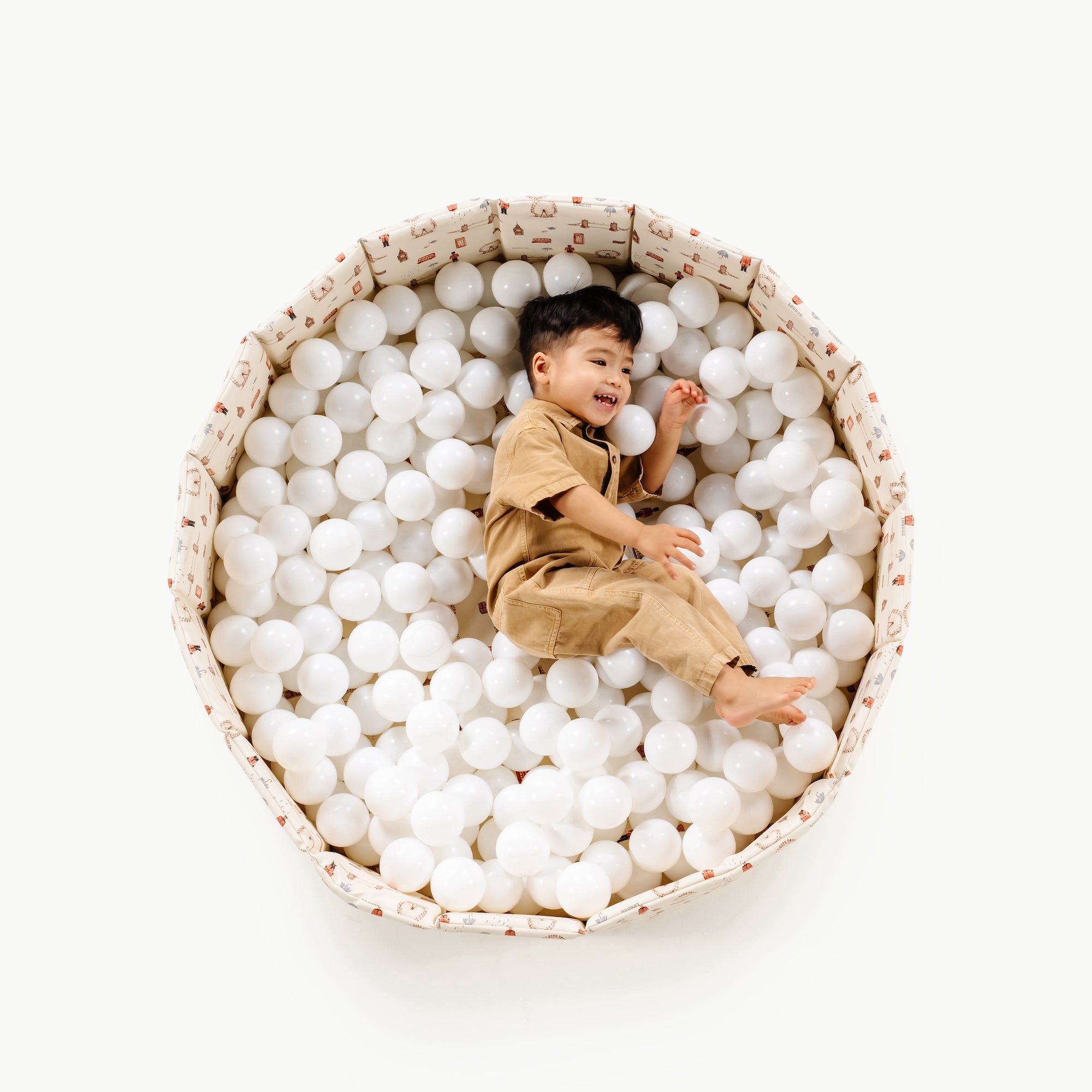 London@overhead of kid playing in the london ball pit